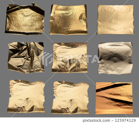 Gold foil with crumpled, shiny metallic texture creates a reflective, luxurious surface. Torn and Gold foil with crumpled, shiny metallic texture creates a reflective, luxurious surface. Torn and 125974129
