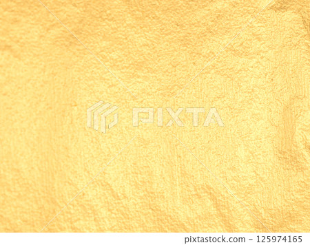 Golden foil leaf with warm, soft light. Subtle, satin texture and reflective surface create a Golden foil leaf with warm, soft light. Subtle, satin texture and reflective surface create a 125974165