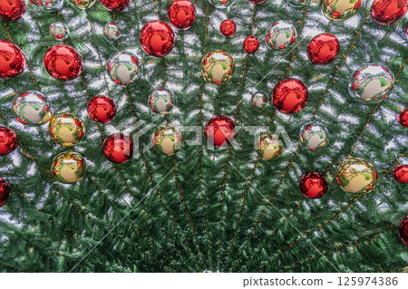 Colorful Christmas Ornaments Hanging on a Beautifully Decorated Tree Colorful Christmas Ornaments Hanging on a Beautifully Decorated Tree 125974386
