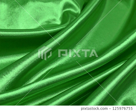 Green satin fabric background 125976755