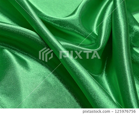 Green satin fabric background Green satin fabric background 125976756