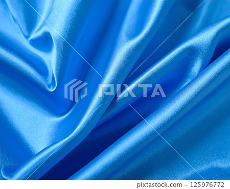 Blue satin fabric background 125976772