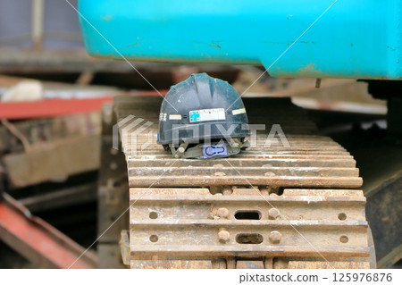 Heavy machinery and construction helmets Heavy machinery and construction helmets 125976876