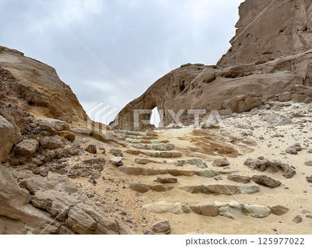An arch formed by erosion and weathering in Timna Park in the Arava desert 125977022