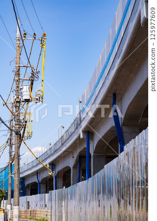 Railway viaduct and electric wire protection pipe under construction, Higashimurayama Station area, Tokyo 2025.04 c-1 125977609