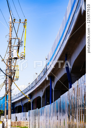 Railway viaduct and electric wire protection pipe under construction, Higashimurayama Station area, Tokyo, April 2025, c-2 High saturation contrast 125977610