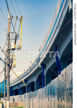 Railway viaduct and electric wire protection pipe under construction, Higashimurayama Station area, Tokyo, April 2025 c-3 Warm and cool colors 125977612