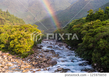 A beautiful rainbow over the Yakushima Offshore Alps (August) A beautiful rainbow over the Yakushima Offshore Alps (August) 125978850