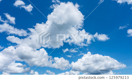 Summer refreshing blue sky and white cumulus clouds 125979213