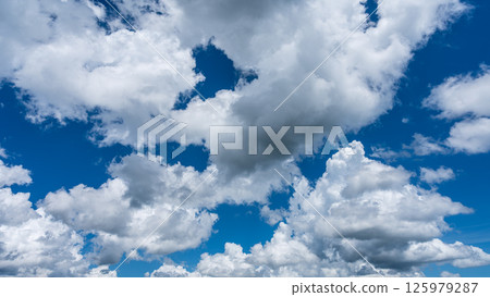 Summer refreshing blue sky and white cumulus clouds Summer refreshing blue sky and white cumulus clouds 125979287