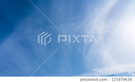 The "Halo Phenomenon" is a mysterious halo of thin clouds and the sun in a clear blue sky. The "Halo Phenomenon" is a mysterious halo of thin clouds and the sun in a clear blue sky. 125979639