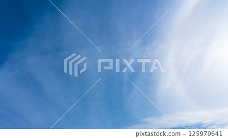 The "Halo Phenomenon" is a mysterious halo of thin clouds and the sun in a clear blue sky. The "Halo Phenomenon" is a mysterious halo of thin clouds and the sun in a clear blue sky. 125979641