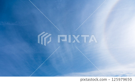 The "Halo Phenomenon" is a mysterious halo of thin clouds and the sun in a clear blue sky. The "Halo Phenomenon" is a mysterious halo of thin clouds and the sun in a clear blue sky. 125979650