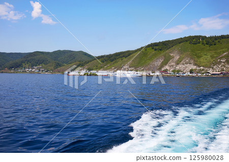 Lake Baikal on a summer day. View of the port from the ship to the port of Baikal 125980028