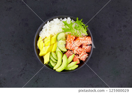 Hawaiian ahi, a diet meal with fish. Poke bowl of salmon, rice, avocado Hawaiian ahi, a diet meal with fish. Poke bowl of salmon, rice, avocado 125980029