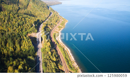 Beautiful landscape from the air. Road and railway along the lake Beautiful landscape from the air. Road and railway along the lake 125980059