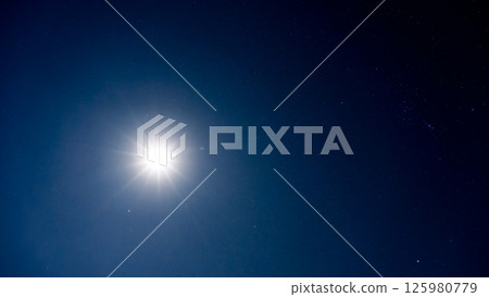 The moonlight illuminating the night sky and countless shining stars 125980779