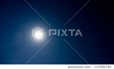 The moonlight illuminating the night sky and countless shining stars 125980788