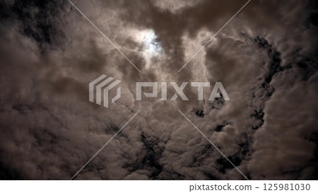Full moon and starry night sky shining through the clouds Full moon and starry night sky shining through the clouds 125981030