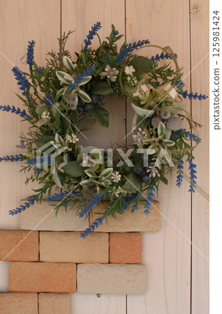 Flower wreath on the wall 125981424