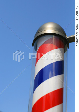 A pole sign shining against the blue sky A pole sign shining against the blue sky 125981426
