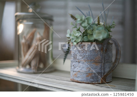 Succulents and glass pots on the windowsill 125981450
