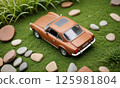 Retro miniature car in a diorama seen from behind 125981804