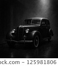 Black classic car at night 125981806