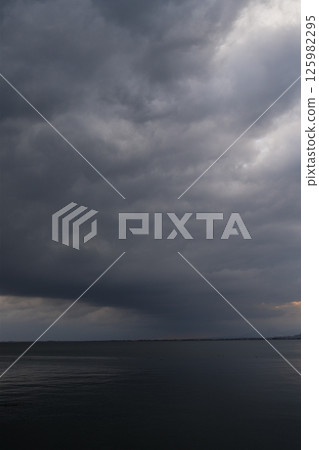 Spring sea covered with thick clouds 125982295