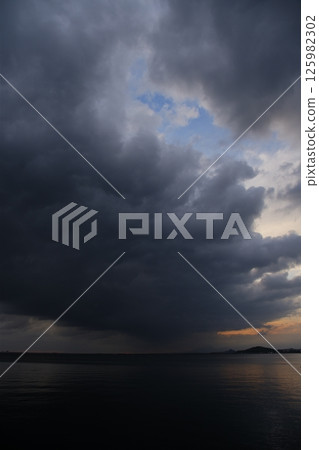 Spring sea covered with thick clouds Spring sea covered with thick clouds 125982302