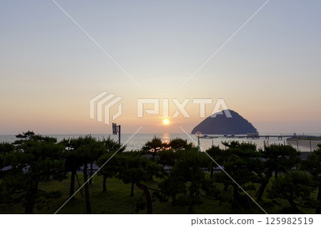 A view of the sun setting over the sea from Asamushi Onsen, Aomori City, Aomori Prefecture A view of the sun setting over the sea from Asamushi Onsen, Aomori City, Aomori Prefecture 125982519