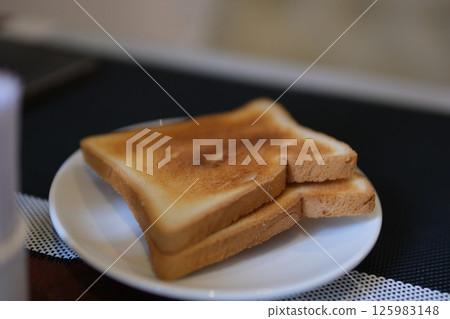 Two pieces of crouton Traditional coffee shop toast bread. Selective focus. 125983148