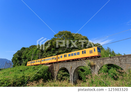 Blue sky and the famous Megane Bridge on the Sangi Railway 125983320