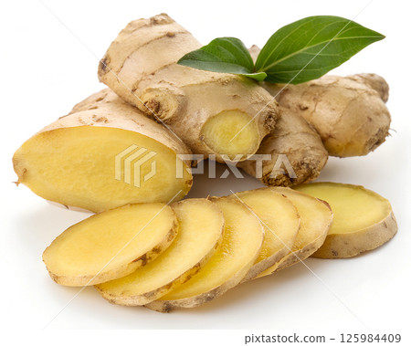 ginger root with sliced rounds, aromatic cooking ingredient and natural herbal medicine on white background ginger root with sliced rounds, aromatic cooking ingredient and natural herbal medicine on white background 125984409
