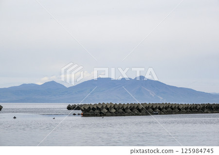 The mountains of the Shimokita Peninsula as seen from Mutsu Yokohama Coast 125984745