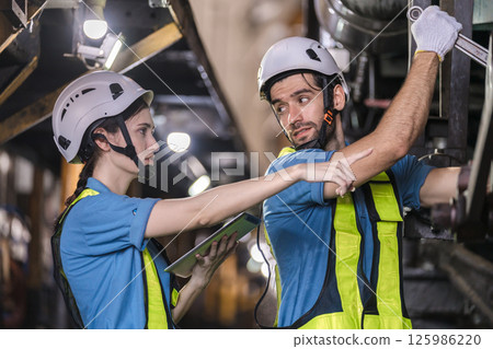 Engineer checking construction process railway and checking work on railroad station 125986220