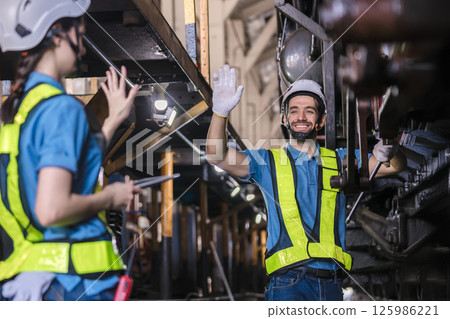 Engineer checking construction process railway and checking work on railroad station 125986221