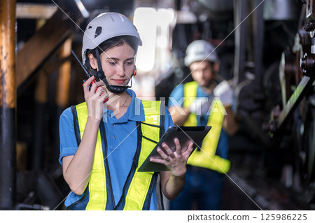Engineer checking construction process railway and checking work on railroad station Engineer checking construction process railway and checking work on railroad station 125986225