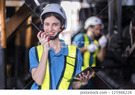 Engineer checking construction process railway and checking work on railroad station Engineer checking construction process railway and checking work on railroad station 125986226