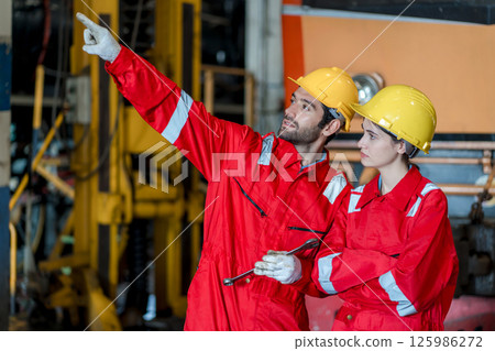 Engineer checking construction process railway and checking work on railroad station Engineer checking construction process railway and checking work on railroad station 125986272
