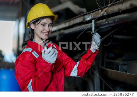Engineer checking construction process railway and checking work on railroad station 125986277