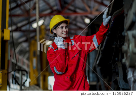 Engineer checking construction process railway and checking work on railroad station Engineer checking construction process railway and checking work on railroad station 125986287