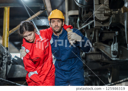 First aid support accident at work of worker at factory.  125986319
