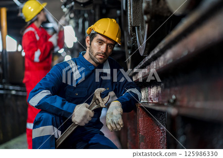 Engineer checking construction process railway and checking work on railroad station Engineer checking construction process railway and checking work on railroad station 125986330