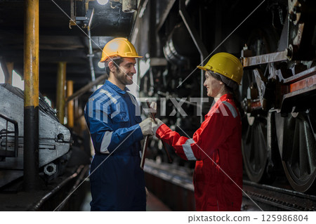 Engineer checking construction process railway and checking work on railroad station 125986804