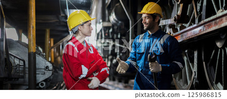 Engineer checking construction process railway and checking work on railroad station 125986815