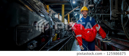 First aid support accident at work of worker at factory. Male worker has an accident on the floor in warehouse site. 125986875