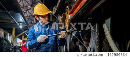 Engineer checking construction process railway and checking work on railroad station 125986884