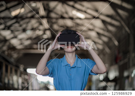 woman, vr and headset with hologram for virtual interaction 125986929