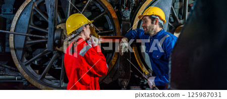 Engineer checking construction process railway and checking work on railroad station  125987031